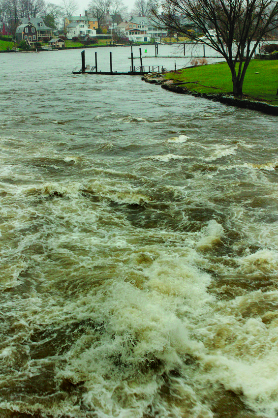 NATURE&rsquo;S POWER: The waters of the Pawtuxet River surge during the floods of 2010 in this Herald file photo.