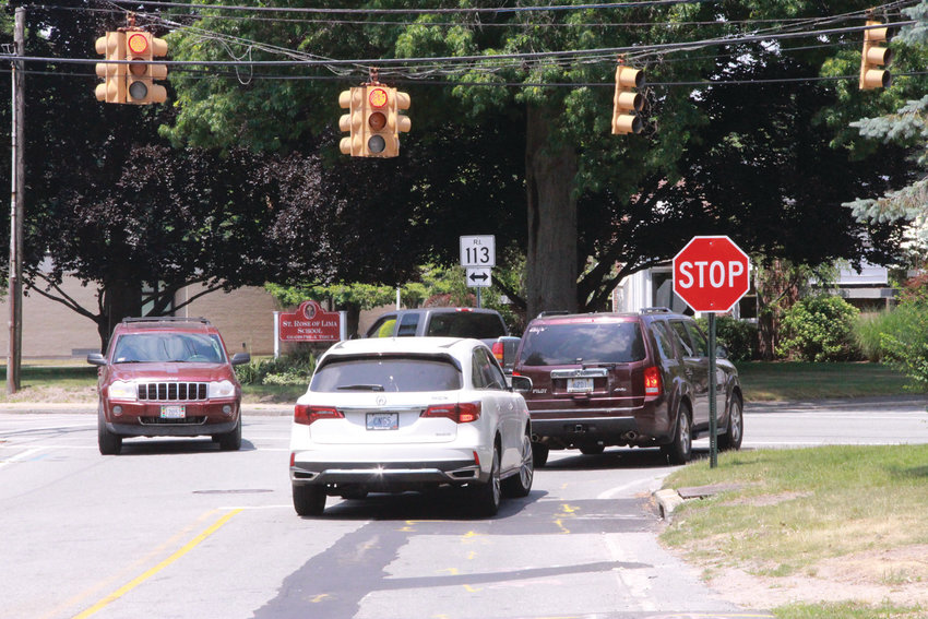 LINING UP:&nbsp; Vehicles on Buttonwoods Avenue wait for a break in traffic on Main Avenue now that the traffic light is not functioning and been placed on the flashing mode. The intersection has been the site of two accidents since the light was deactivated five weeks ago.