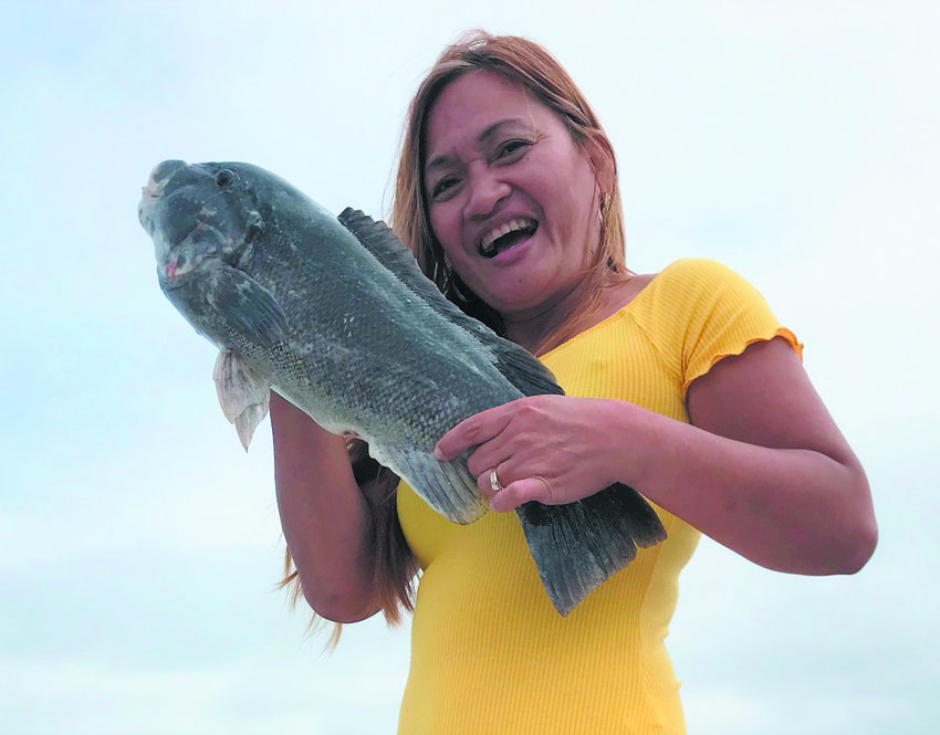 TAUTOG FISHING HOT: Liz Cyr caught this 22-inch tautog Sunday when fishing in the General Rock/Ledge area in Narragansett Bay with her husband Don Smith.