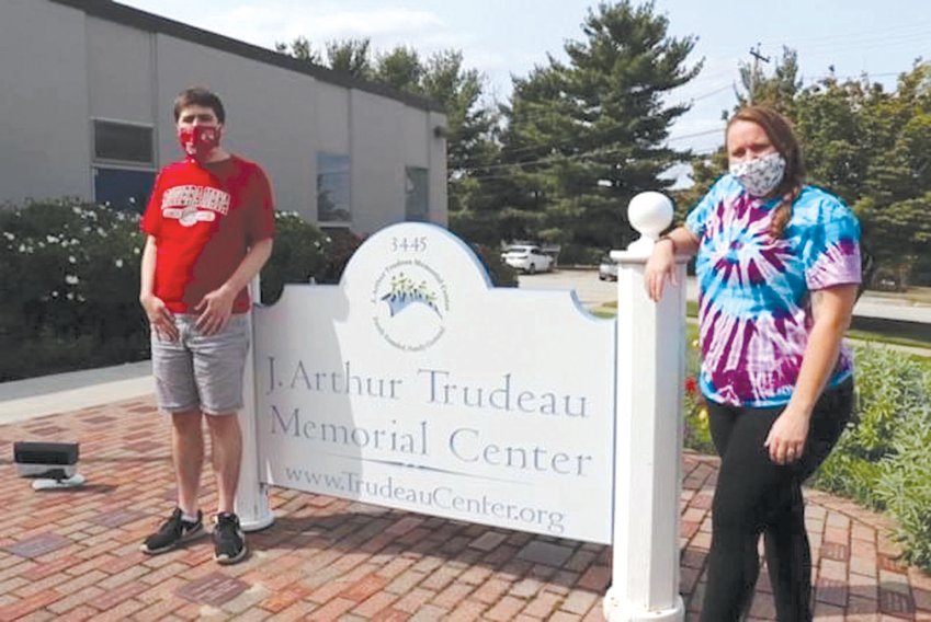 WORKING FROM HOME NOW: Josh Langevin and Nicole Kristant outside the Trudeau Center in Apponaug. Because of the pandemic, Kristant is working with Langevin at his home these days.