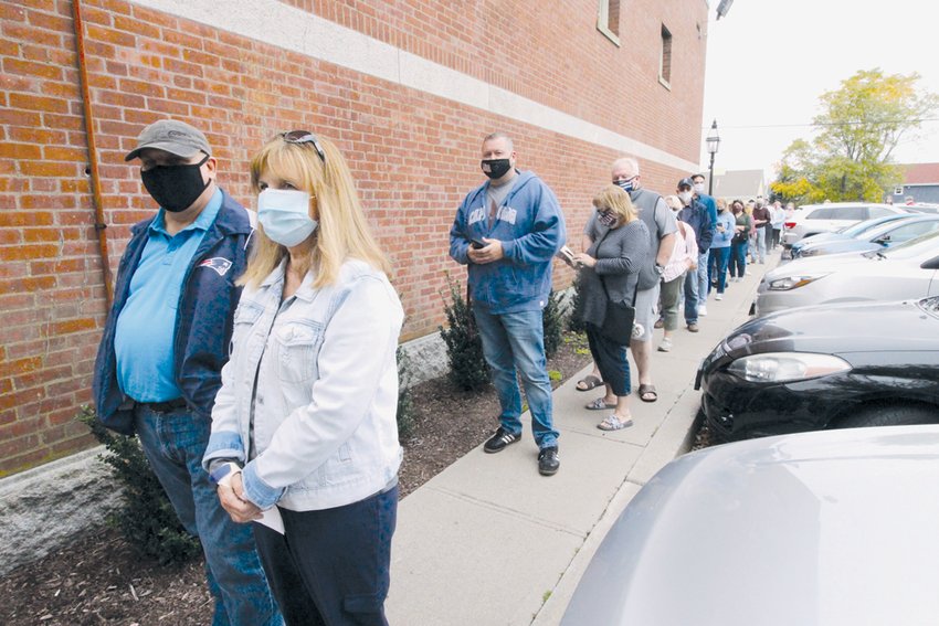 OUT THE DOOR: Voters have been lined up outside Warwick City Hall on more than one occasion since early voting started on Oct. 13. This shot was taken last Thursday. By Tuesday afternoon, 18,529 Warwick voters had cast early and mail ballots.