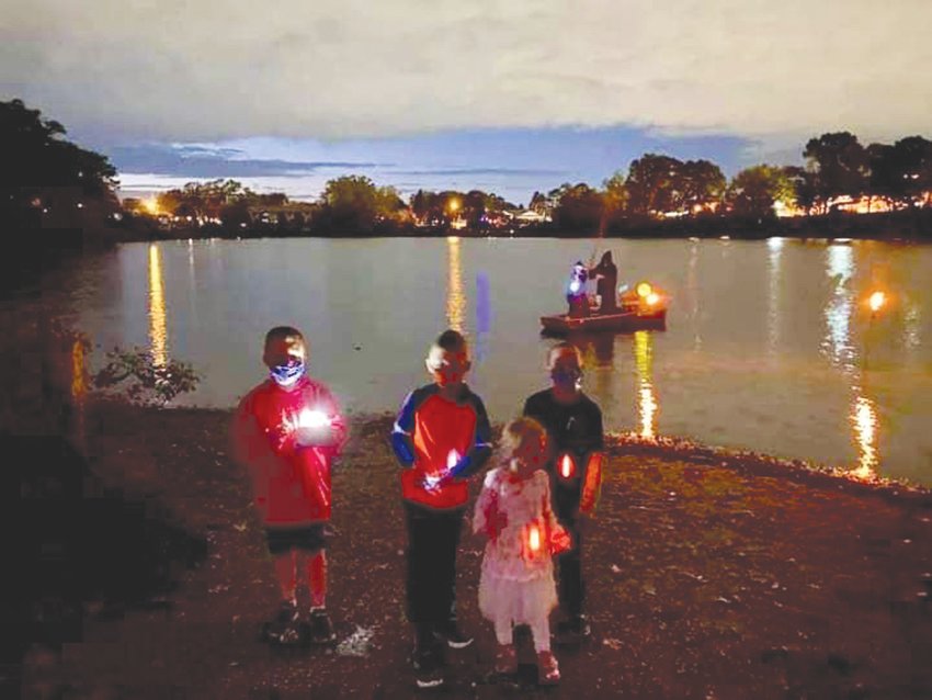 BY LAND AND POND: Dressed for the occasion Sand Pond neighbors celebrated Halloween Oct. 24.