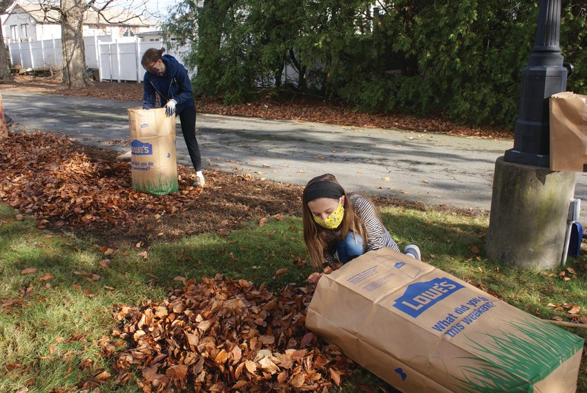 FAMILY TEAM:&nbsp; Lindsay Hart and her daughter, 12-year-old Madelyn, worked together during last weekend&rsquo;s cleanup at Sprague Mansion.