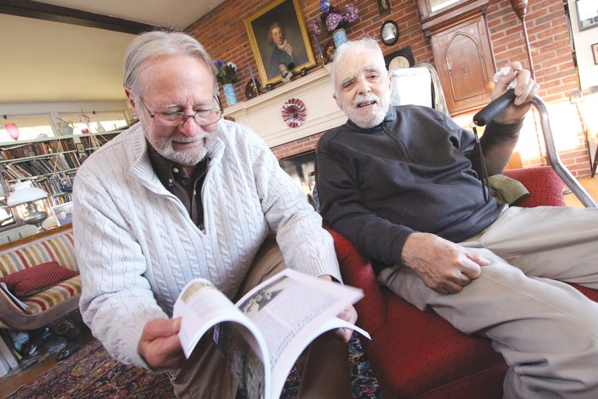 GETTING ACROSS THE POINT: Roger Hudson, left, and Warwick historian and author Henry A. L. Brown leaf through Henry&rsquo;s newest book, &ldquo;Gaspee Point.&rdquo;