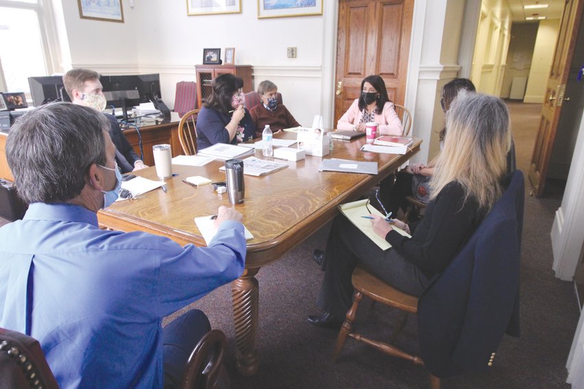 STARTING THE DAY: Mayor Picozzi meets with his administrative staff, lining up events for the day and gaining input on issues and developments.