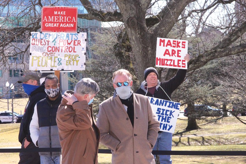 FEW SPECTATORS: Unlike prior inauguration ceremonies, the south lawn to the State House had hardly a spectator, although there were a few who took the opportunity to promote their point of view.