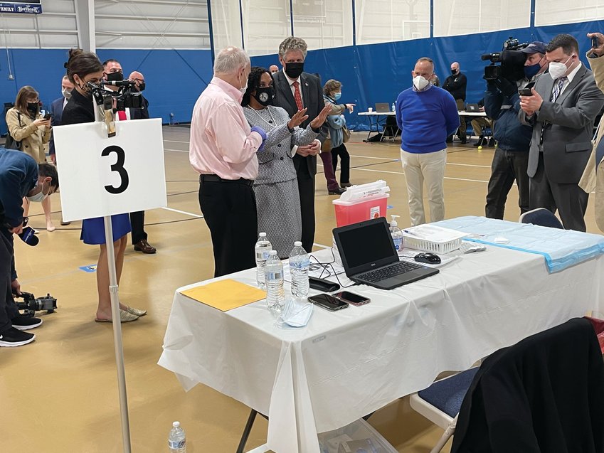 STEPPING UP: Providence City Council President Sabina Matos, center, visits the COVID-19 vaccination clinic at the Johnston Recreation Center last Wednesday. Looking on are Johnston Mayor Joseph Polisena, left, and Gov. Dan McKee.