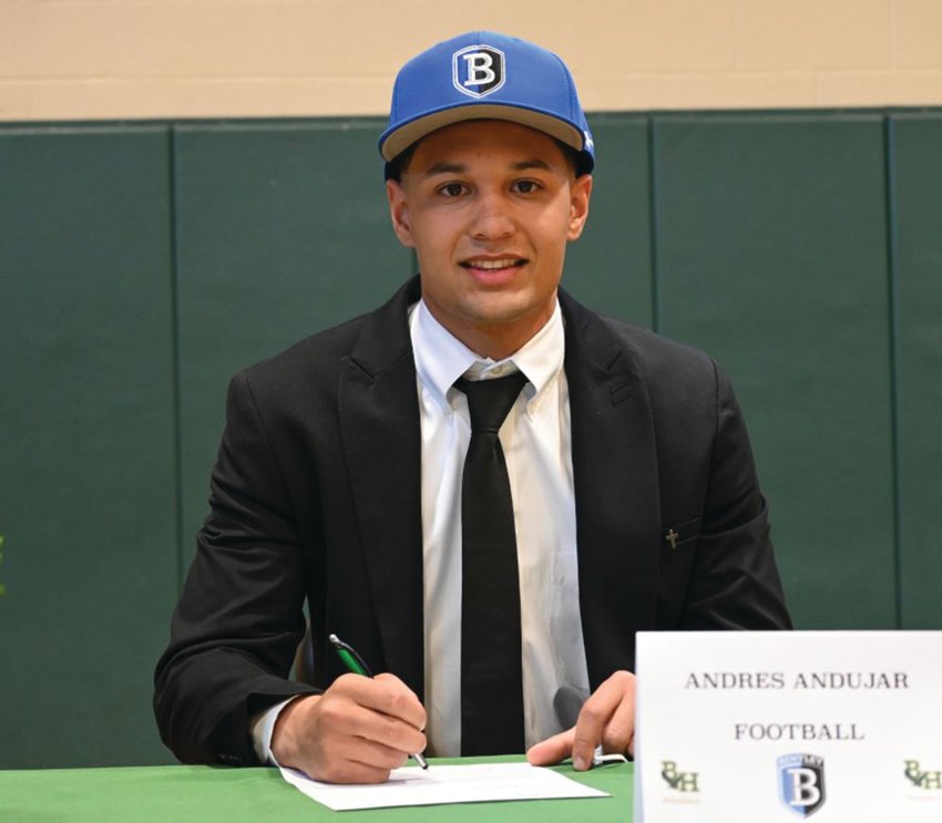 MAKING IT OFFICIAL: Bishop Hendricken two sport athlete and Cranston resident Andres Andujar signs his National Letter of  Intent to play Division II football for Bentley University. Andujar has been one of the top defensive backs in the state this season and will be playing for a state championship this weekend against La Salle.