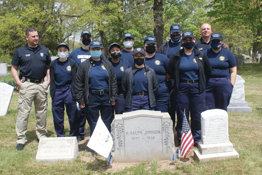 PAYING TRIBUTE: Members of the Cranston Police Explorers visited the graves of four fallen Cranston Police officers this past Saturday to pay tribute and place memorial flags. Also pictured are Inspector Thomas Okolowitcz, and Detective Robert Santagata.&nbsp;