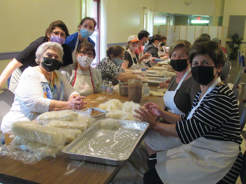 BAKING BRIGADE: This has been the scene time and again in recent weeks as volunteers at the Church of the Annunciation worked tirelessly to prepare the famous Greek pastry for this weekend&rsquo;s Greek Fest Express. From left, Anna Demetrakas, Ethel Strekouras, Vikki Poulos and Nancy Harritos enjoy a break while working alongside Dina Fotopoulos and Rita Liakos.