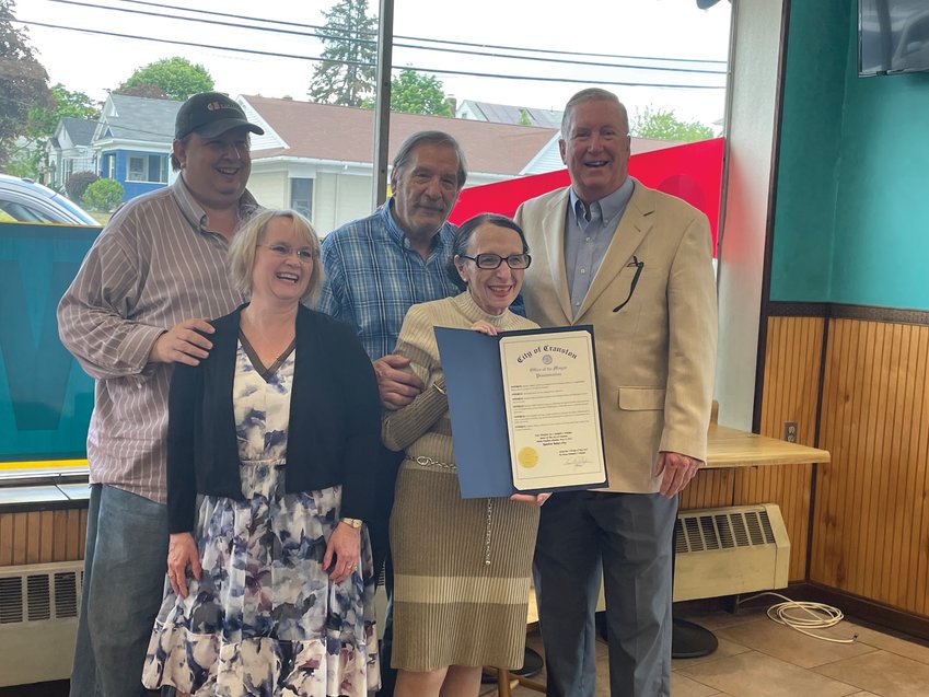 THEY FOUND THEIR POT OF GOLD: Cranston Mayor Ken Hopkins presents the Kaplan family with a city proclamation at the last day of business, Saturday. Pictured, at front, are Heather and Deby Kaplan, and in back, Scott and Murray Kaplan and Hopkins.