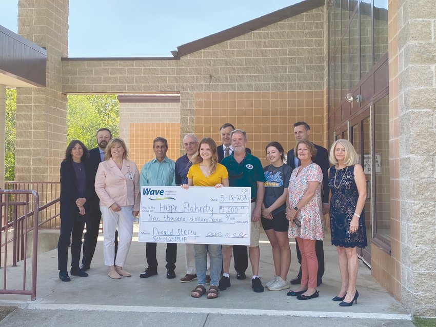 AT WAVE EVENT: Pictured left at Financial Literacy Day ceremonies at Toll Gate High School are: Regina Wilkinson of Toll Gate guidance, Wave Credit Union COO Dave Dupere, Principal Candace Calouri, Mayor Frank Picozzi, Wave CEO Paul Archambault, Hope Flaherty, Assistant Superintendent William McCaffrey, Joe Flaherty, Rose Flaherty, General Treasurer Seth Magaziner, Shelley Flaherty, and Superintendent Lynn Dambruch.