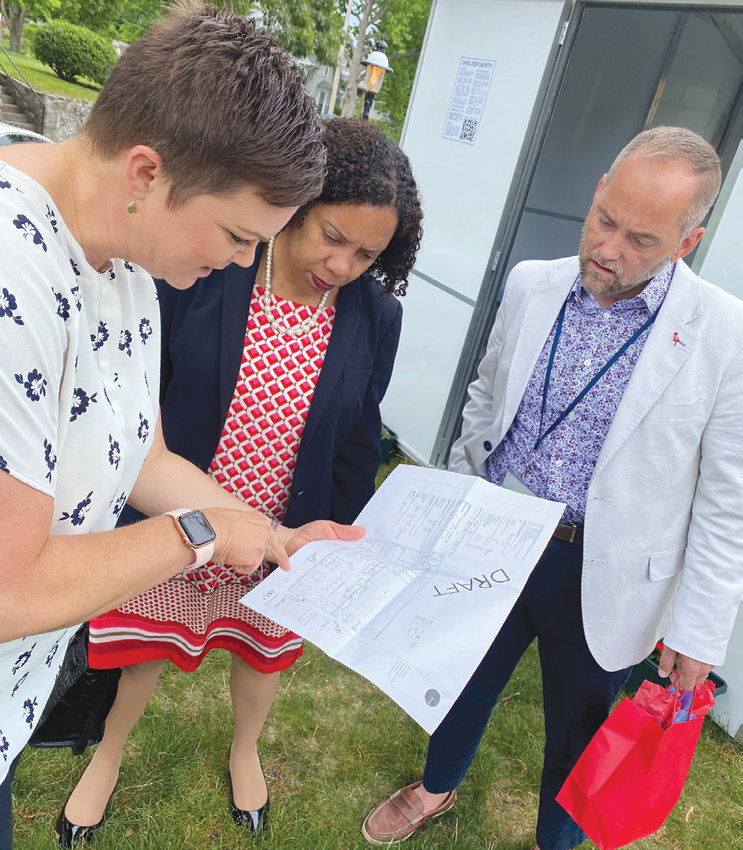 STILL IN THE WORKS: From left to right, House of Hope executive director Laura Jaworski, Lt. Gov. Sabina Matos, and policy analyst Billy Kepner look at a draft of plans for the ECHO Village.