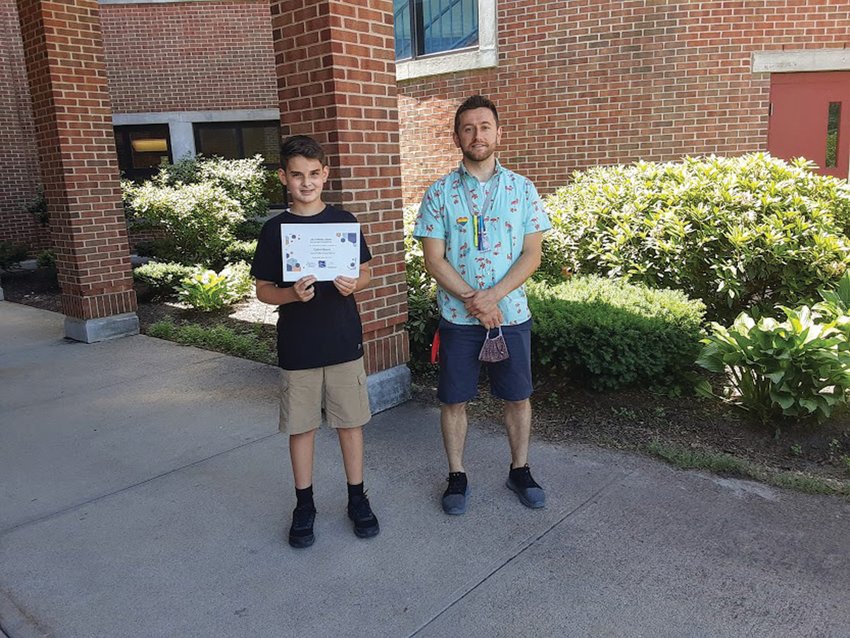 TWO-TIME AWARD WINNER:&nbsp; Hope Highlands Middle School seventh-grader Caden Baum poses with educator Paul Spencer, who served as his faculty advisor two years in a row for the Environmental Systems Research Institute&rsquo;s Aeronautical Reconnaissance Coverage Geographic Information System (ESRI ArcGIS) Mapping Competition. Baum was awarded first place at the middle school level in 2020 and again in 2021.