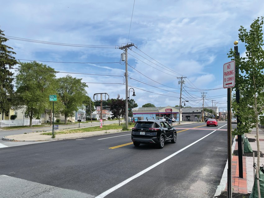 ONE WAY?&nbsp; Vehicle travel north on Rolfe Square Tuesday morning. The City Council&rsquo;s Ordinance Committee last week continued consideration of a proposal that would make the street one way.