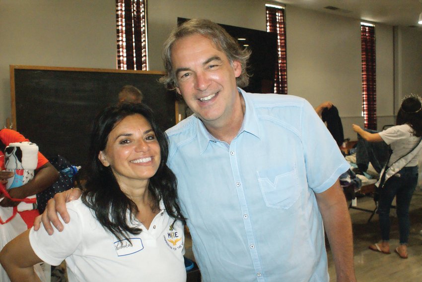 IT&rsquo;S TEAMWORK: Martinha Javid, founder of the MAE Organization for the Homeless, and Pastor Al Pangburn from Praise Tabernacle Church took a moment out of a busy day last Sunday during the Hope for the Homeless Summer BBQ