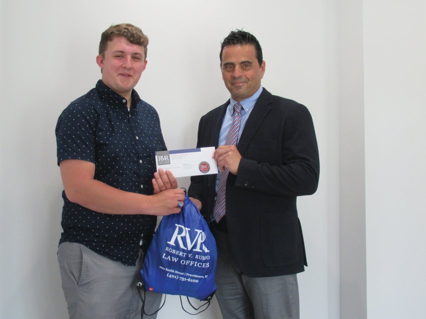 PRESENDIAL PACK: Nicholas Cronan, president of Johnston High School&rsquo;s Class of 2021, accepts the prestigious Robert V. Russo Law Scholarship from the Town Council President who has been awarding the grant &ndash; in form of giving back to his alma mater &ndash; for the past seven years.