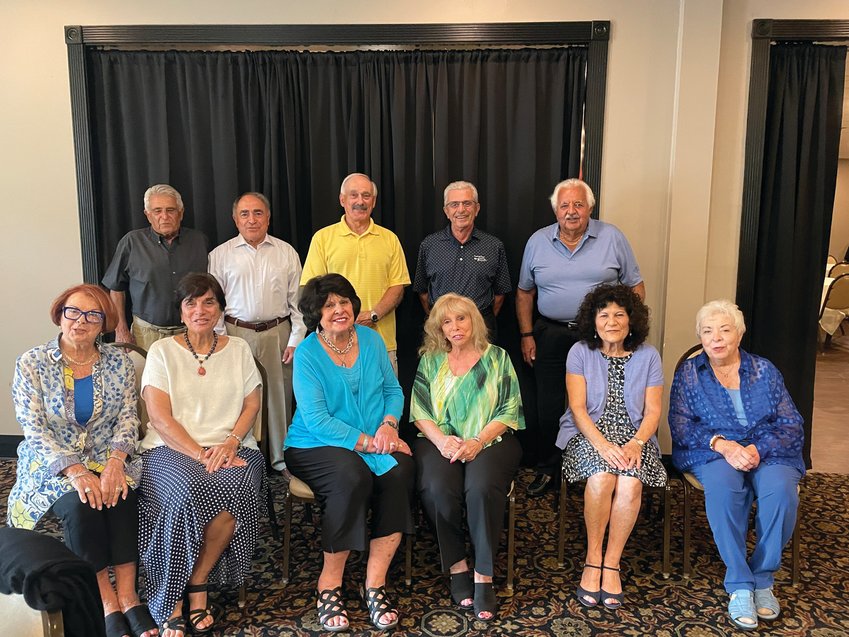 FRIENDS TILL THE END: Members of the Knightsville Elementary School kindergarten class of 1948 gathered at Cucina Rustica on July 15 for their 74-year reunion, held to coincide with St. Mary&rsquo;s Feast. Seated, from left, are Valerie DiBiase McIntyre, Sandra Santagata Nolette, Dolores DiMeo Carroll, Diane Paone Del Bonis, Marjorie Palazzo Gallo and Ann Palmaccio McDermott; and standing, from left, are Robert (Bob) Susi, Dr. Joseph Pezza, Raymond Saccoccio, Pasco Saccoccia and Richard Squizzero.