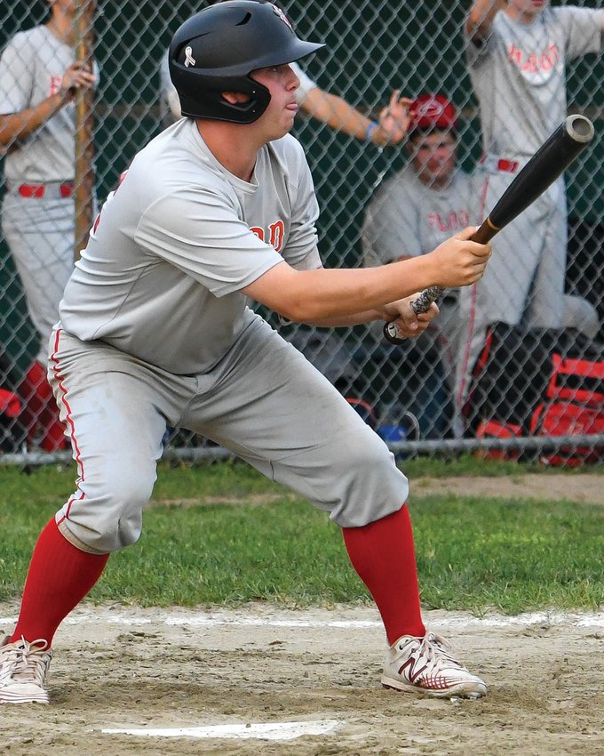 DROPPING A BUNT: Chris Manzo lines up to bunt.