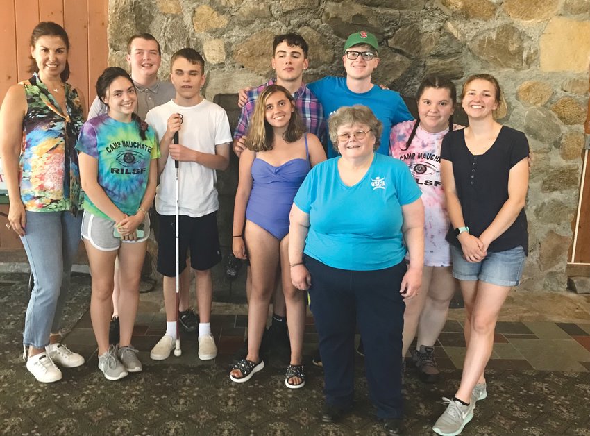 AT CAMP: OSCIL staff members Mirelle Sayaf, Beth Pinkham and Amanda Reed are pictured with students of the Youth Transition Program.