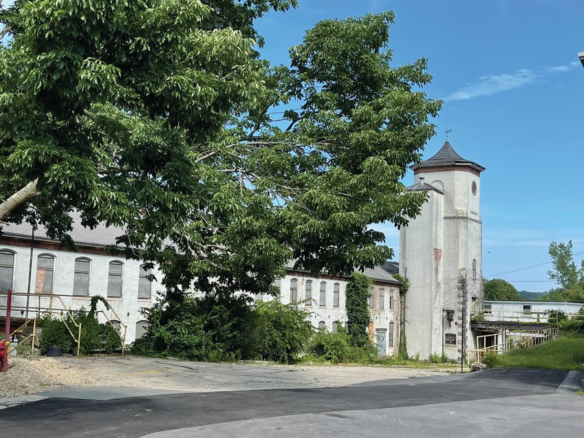 FUTURE APARTMENTS? The redevelopment proposal for the Cranston Print Works property would see the main mill building on the eastern bank of the Pocasset River, pictured here, converted into nearly 100 apartments and almost 70,000 square feet of self-storage units.