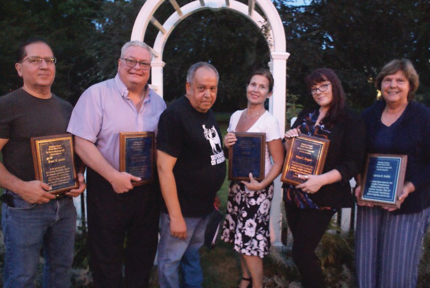 AWARD WINNERS: Dennis Tabella, director of Defenders of Animals, poses with the five individuals who received Humane Hero awards at the 27th annual Homeless Animals Day/Candlelight Vigil on Aug. 21 at Sprague Mansion in Cranston. He is joined by, from left, Bruce Lossini, William W. O&rsquo;Brien, Robin Aptt, Tonya C. Keegan and Patricia Kohler.