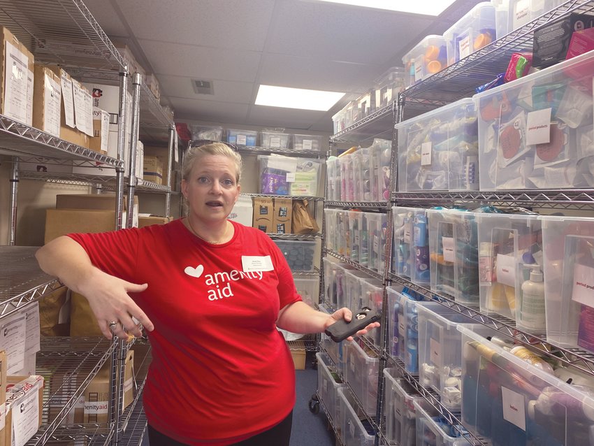 READY TO BE PACKED:&nbsp; Stacey Silva, Amenity Aid board member, gives a tour of the new headquarters on Jefferson Boulevard. (Warwick Beacon photos)