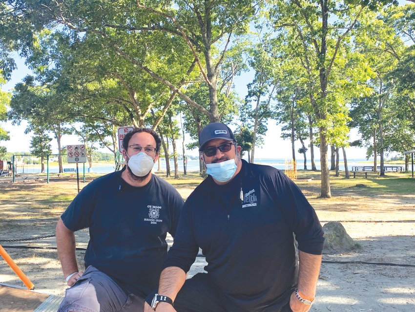 Warwick resident David  Romano (right) said that  he was excited when he  found out that &ldquo;Out of the  Blue,&rdquo; a film that he worked  on would be filming at  Warwick City Park this  week which is down the  street from his home. One  of his crew members Brian  O&rsquo;Connor, left, said that he  had about a 15 minute  commute to the park from  his home in East Greenwich