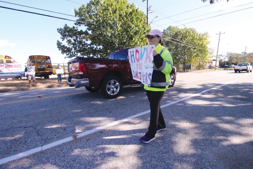 BETWEEN ROUTES: First Student bus drivers manned an informational picket line in front of First Student offices on Strawberry Field Road this week after rejecting a tentative agreement last Thursday.