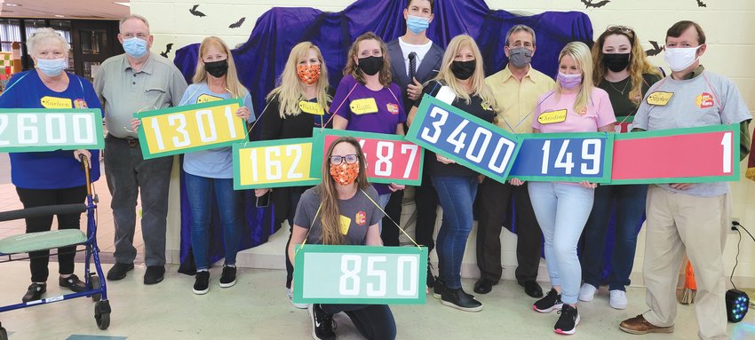 THE RIGHT ATTIRE FOR THE RIGHT OCCASION: The Pilgrim Senior Center staff dressed appropriately for the party. As the television program &ldquo;The Price is Right&rdquo; is a favorite  at the center they carried prices.