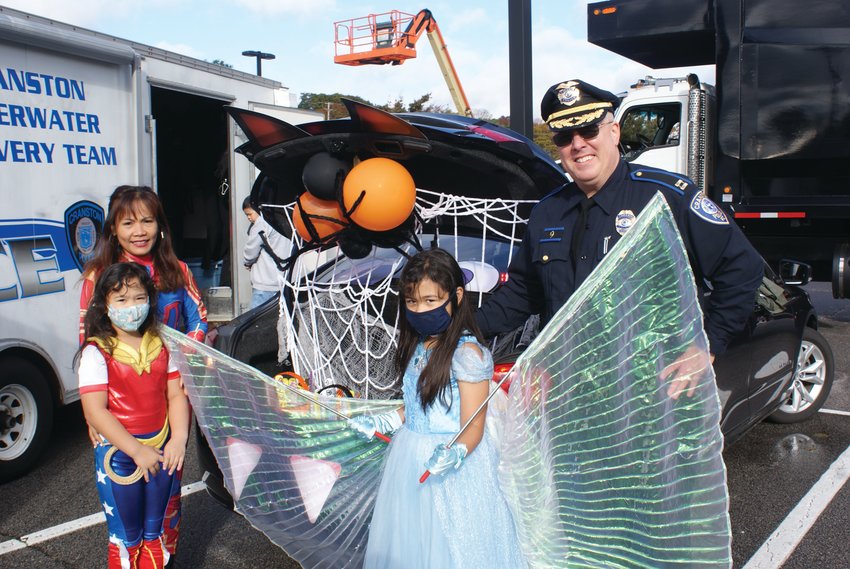 ALL IN THE FAMILY: Cranston Police Officer Matt Kite is pictured with his family during the event &ndash; Kim San Kite dressed as Captain Marvel, and their children Leah, 7, dressed as Wonder Woman and Aria, 8, dressed as a fairy.