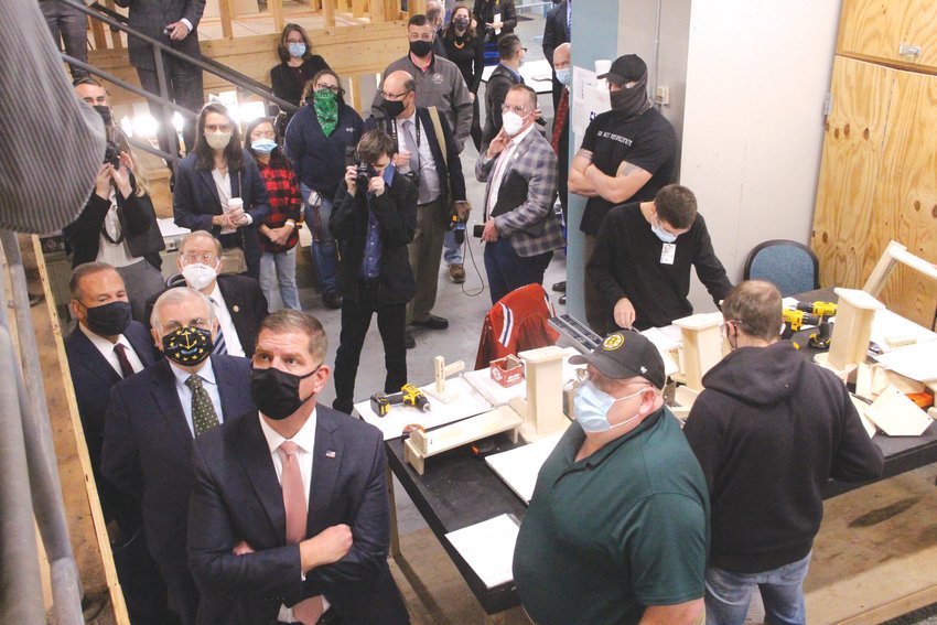 A BIG SUBMARINE: U.S. Labor Secretary Marty Walsh along with U.S. Senator Jack Reed examined a wooden dummy  of the inside of a submarine during a visit to the New England Institute of Technology Warwick campus on Monday