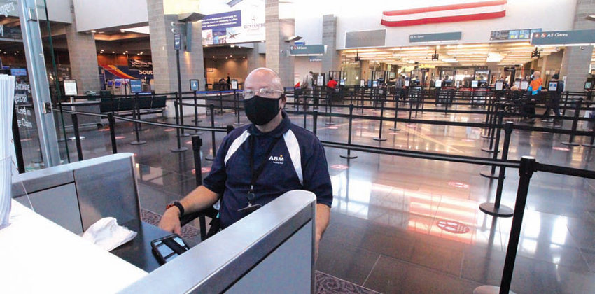 CALM BEFORE THE STORM? James Ball, who recently returned to the workforce working for ABM, waits between flights at the airport Tuesday morning. That&rsquo;s all expected to change next week, as traditionally one of the busiest times for air travel is the Wednesday before and the Sunday after Thanksgiving.