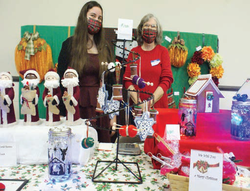 ALL THINGS CHRISTMAS: Lana Dufour and Joanne  Lovejoy participated in the Holiday Bazaar at Phillips  Memorial Baptist Church by selling their Christmas crafts  made by both women and Lana&rsquo;s grandmother, Kathy  McKinney.