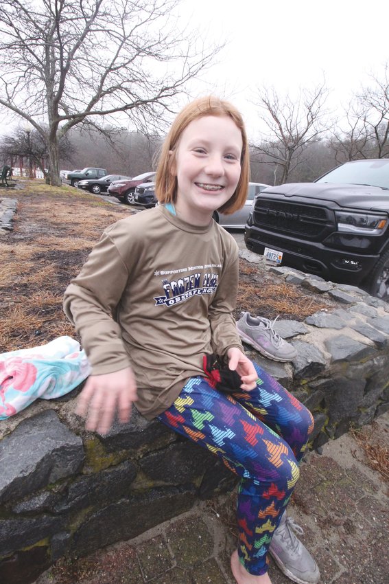 DRYING OFF: Used to being on the ice, hockey player Lauren Bastien, dried off between two dips with her teammates Saturday at Goddard Park New Year&rsquo;s Day.