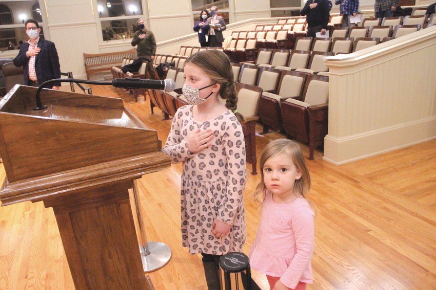 LEADING THE PLEDGE: Emily Foley with her sister Claire at her side led the City Council in the Pledge of Allegiance Monday night. The girls are the granddaughters of Ward 1 Councilman William Foley. Steve McAllister has made a point of inviting young people to lead the council in the pledge since his colleagues elected him president.