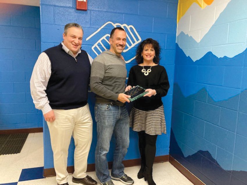 CHANGE IN GUARD: John Rainone, left, is pictured with outgoing  board chair John Delemontex and club executive director Lara D&rsquo;Antuono.