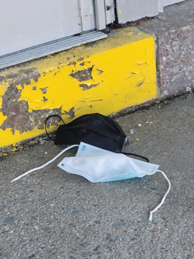 FAREWELL FACE-COVERINGS? A pair of masks were tossed to the ground outside Ferri Middle School last week, the same day Gov. Dan McKee announced a shift in statewide masking policy. The Johnston School Committee will vote Feb. 17 on whether to make masks mandatory in Johnston schools after March 4.