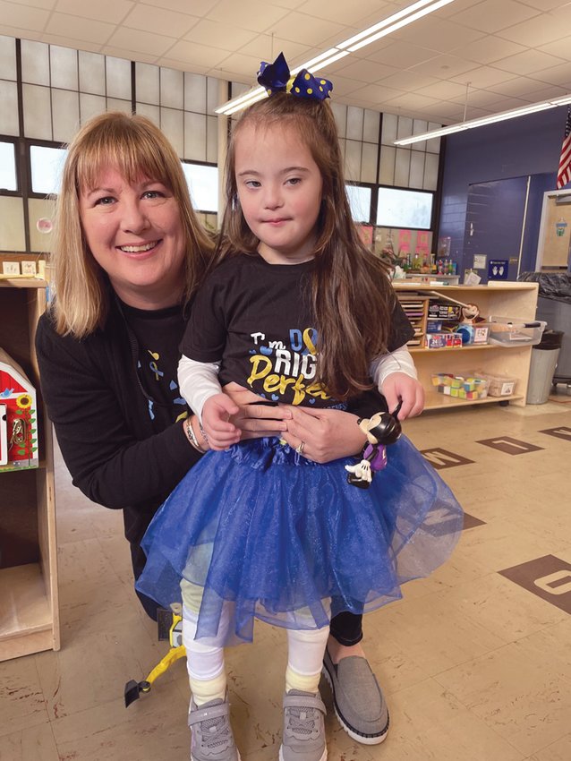 DRESSED UP FOR THE DAY: Sophia Falcone, age 4  of Stadium Elementary School celebrates with her teachers.