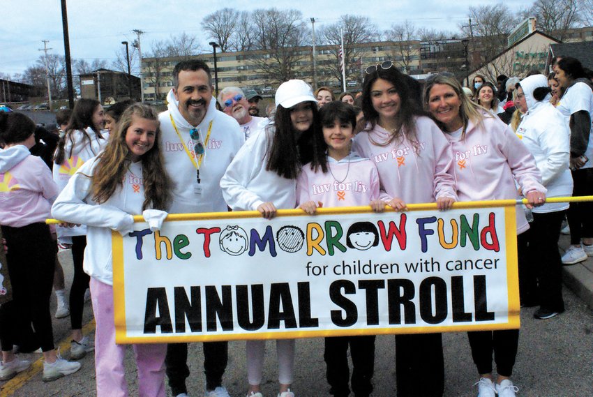 THE STEP OFF: Each year, a team is chosen to lead the Stroll. This year it was the family of Olivia Falzone, a Tomorrow Fund client. Carrying the banner for the &ldquo;Step Off&rdquo; was Taylor DeMond, Chris Falzone, Olivia Falzone, Alex Falzone, Gianna Falzone and Lynn Falzone.