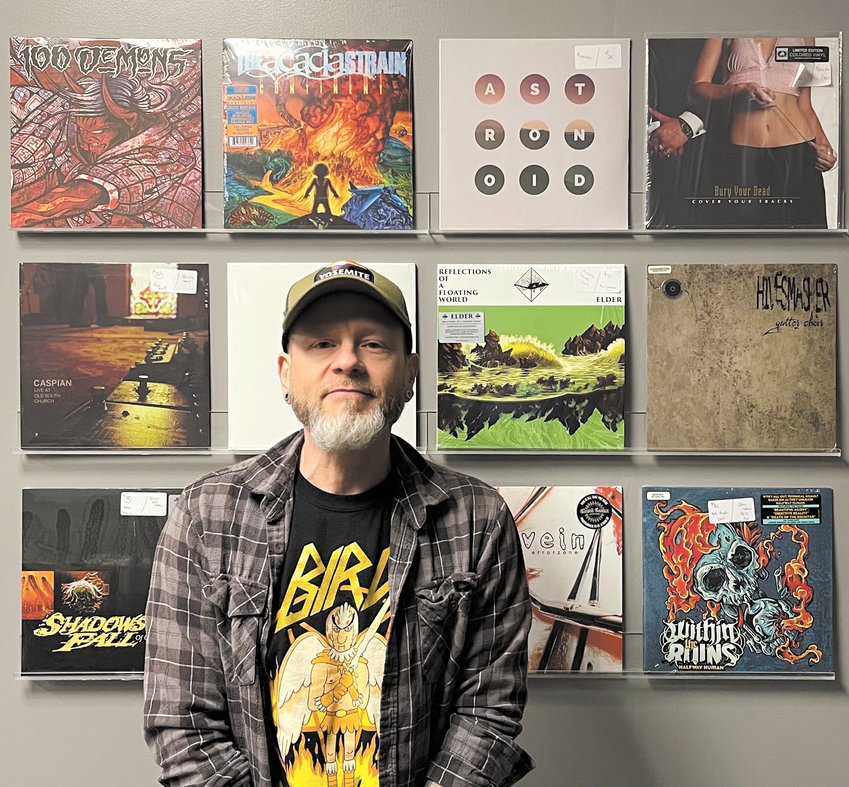 NEW VENTURE: Eric Browning outside his new store, Doomed Records, on the Cranston side of the river in Pawtuxet Village. (Warwick Beacon photo)