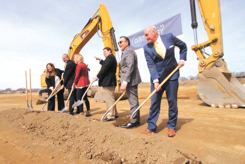 GRAB A SHOVEL: Spotting  there were shovels to spare at Tuesday&rsquo;s ceremonial groundbreaking of the NorthPoint  489,000 square foot warehouse off Airport Road, Council President Steve McAllister points  to  Ward 1 Councilman Bill Foley to  join the group. According to Natasha Rickel a spokesperson for NorthPoint the project is &ldquo;currently scheduled to deliver late November.&rdquo; Pictured with McAllister is Eva Mancuso special advisor to the governor,  Commerce Secretary Stefan Pryor, Regional Vice President for NorthPoint Development Christina Hubacek, Tom Moses,  attorney for NorthPoint and Kelly Coates, president of Carpionato Group that sold the property to NorthPoint. (Warwick Beacon photo)