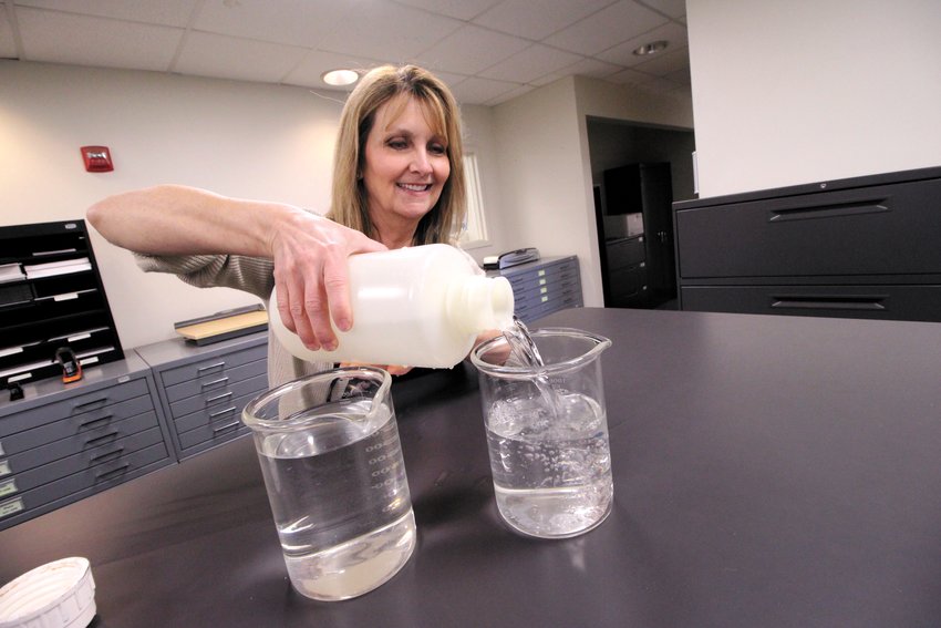 CAN YOU TELL THE DIFFERENCE? Look closely, but it&rsquo;s unlikely you can identify tap water from effluent from Warwick&rsquo;s wastewater treatment plant. Here Betty Anne Rogers , executive director of the Warwick Sewer Authority fills a beaker with effluent discharged into the Pawtuxet River. (Warwick Beacon photo)