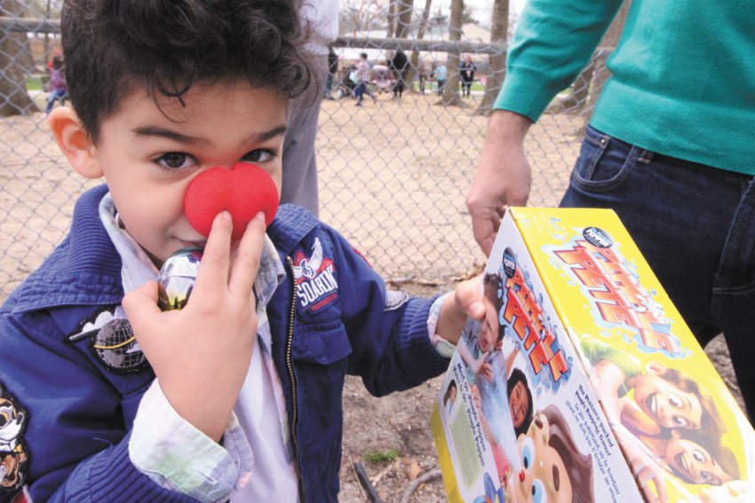 WORTH A PRIZE: Liam Leavitt makes sure his red nose stays in place after claiming his prize.&nbsp;