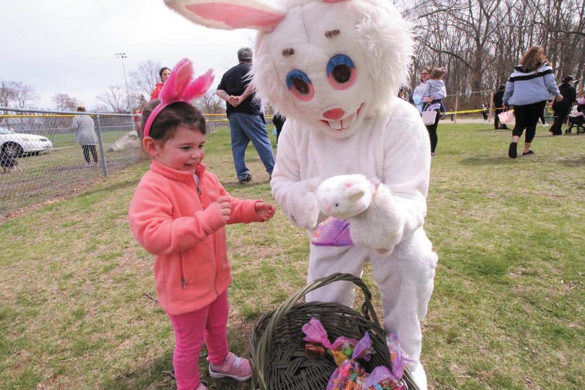 BUNNY FOR A BUNNY: Three-year old Catherine Barbeau offered to give her bunny to the Easter Bunning at the Conimicut Village hunt.&nbsp;(Warwick Beacon photos)