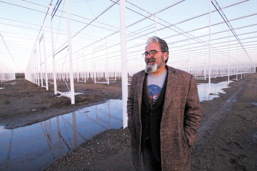 SIZE OF THE WARWICK MALL: Tim Schartner is pictured inside the steel framework designed to support the 25-acre greenhouse RI Grows is building in Exeter shortly after work came to a halt late last year. He is hopeful of clearing legal hurdles soon so as to start growing tomatoes. (Warwick Beacon file photo)