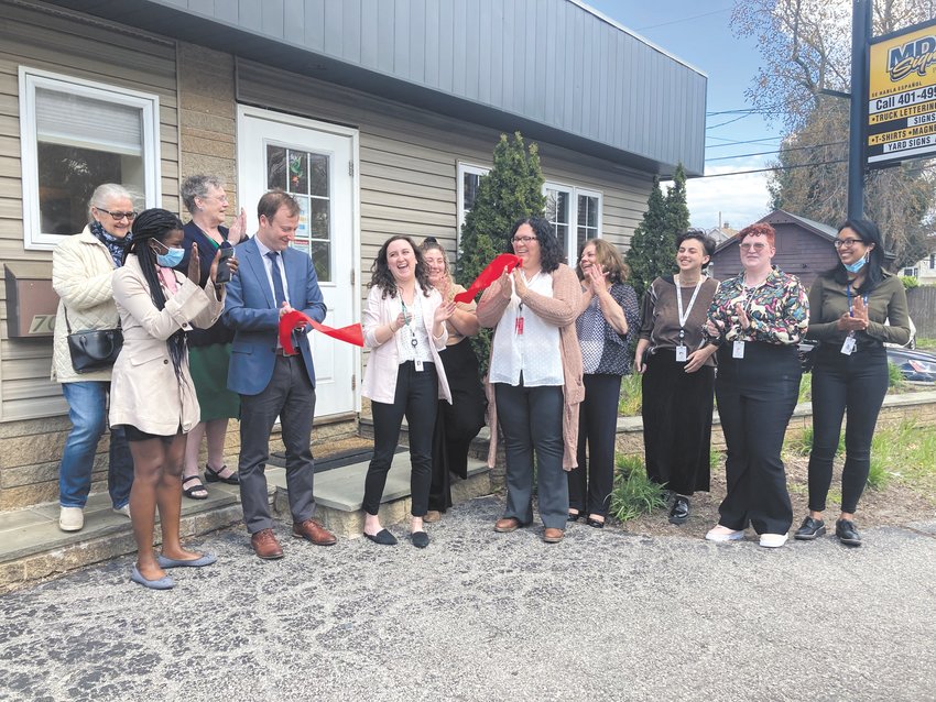 MAKING IT OFFICIAL: (Left to right) Annette Bourne, Nwando Ofokansi, Grace Swinski,  Zachary Nieder, Sarah Cote, Brandi Silvia, Celia Hernandez, Joanne McGonagle, JB Fulbright, Ivy Swinski and Monica Phan join for the ribbon cutting of OneCranston Health Equity Zone&rsquo;s (HEZ) center. (Cranston Herald photo)