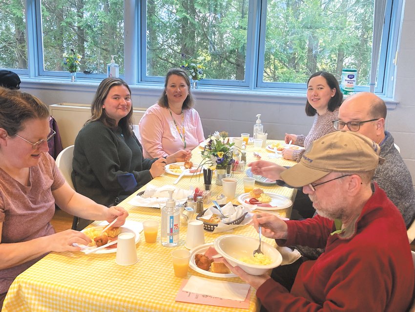 ENJOYING THEIR BREAKFAST: With an assortment of eggs, ham, cornbread, clam cakes, pie, coffee and tea, breakfast goers certainly had a diverse selection of food to choose from. (Left side front to back) Kim Calcagno, Jordan Marchetti and Susan Marchetti. (Right side front to back) Christopher Martin, David Stone and Allison Marchetti.