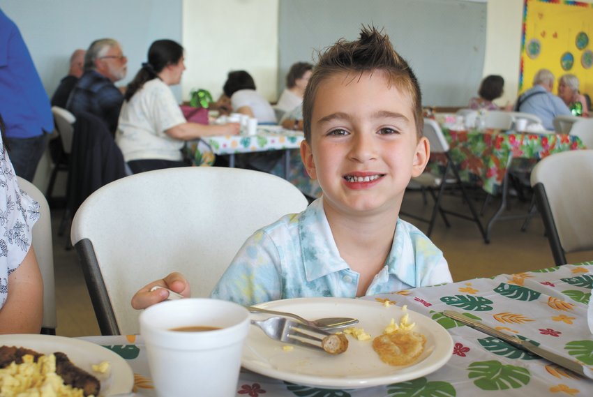 ENJOYING BREAKFAST: Enjoying his May Breakfast at Woodridge Church was Orson Grilo, 6.