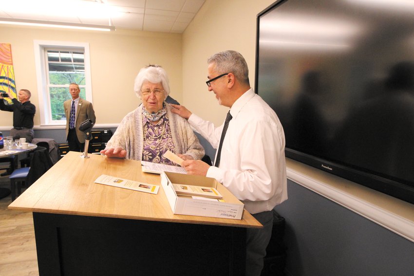 A SPECIAL THANKS: Wayne Pimental of the Building Officials Association introduces Carol Netcoh,  widow of Sam Netcoh who founded Netcoh Sales.  The company is a major contributor of tools to the graduating seniors.